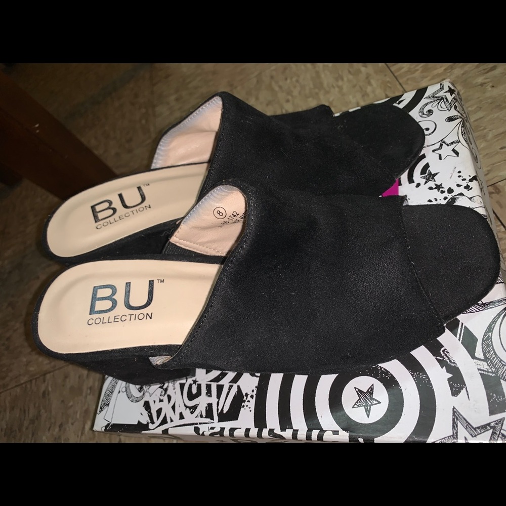 Black open toe mule. Never worn!!